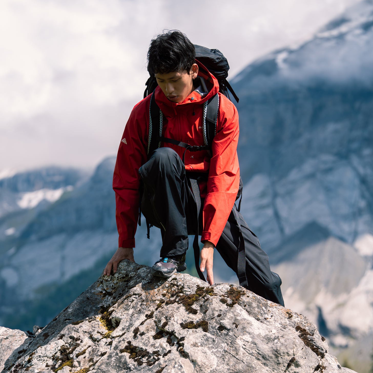 Hiker in a Cortazu shell jacket on a mountain trail